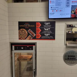 My lonely pizza waiting for me and their party specials.