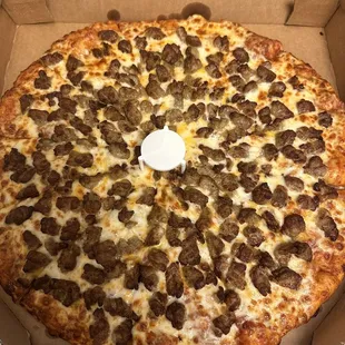 a pizza in a cardboard box