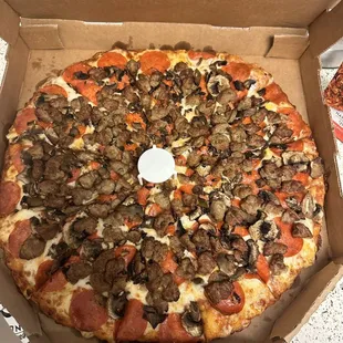 a pizza in a cardboard box