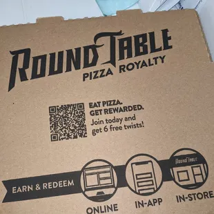 a pizza box with a qr code on it