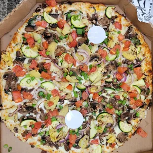 a pizza in a cardboard box