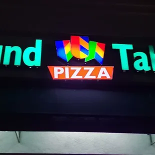 a neon sign for a restaurant