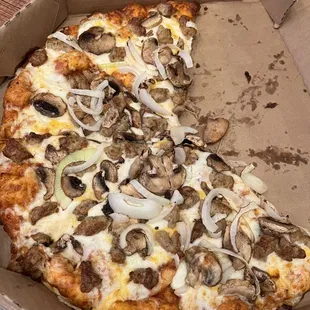 Sausage pizza with mushrooms and onions