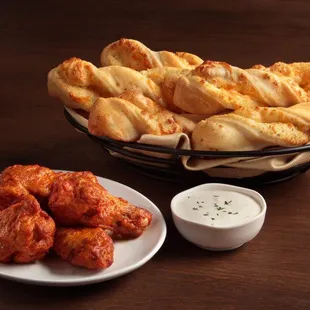 Mouth-watering classic wings and garlic parmesan twists paired with a cool side of ranch.