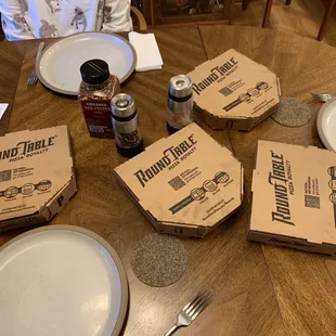 The dinner spread, four to-go personal pan pizzas.