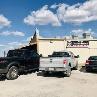 trucks parked in front of a building