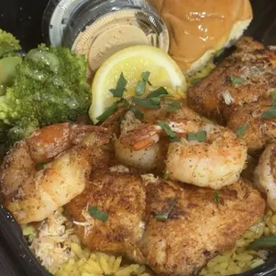 Shrimp &amp; Salmon over yellow rice with crab meat &amp; broccoli