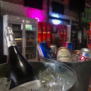 a bottle of champagne in a bucket of ice