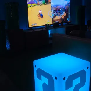 a glowing light cube in a dark room