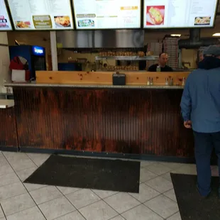 a man standing at a counter