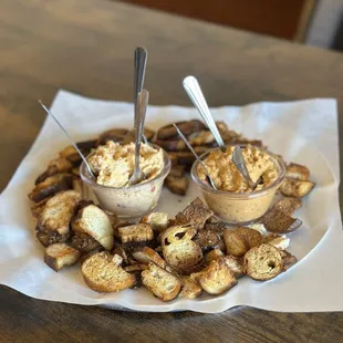 Pretzel chips with pimento cheese dip and red pepper hummus