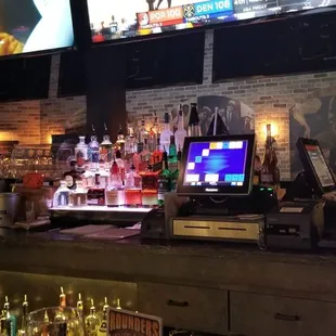 a bar with multiple televisions