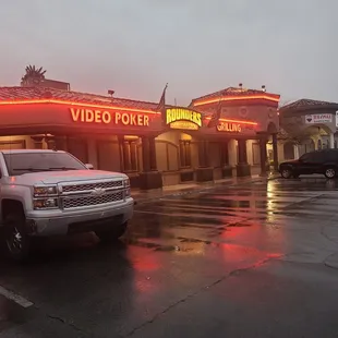 a truck parked in front of a video poker shop
