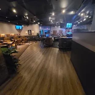 an empty restaurant with tables and chairs