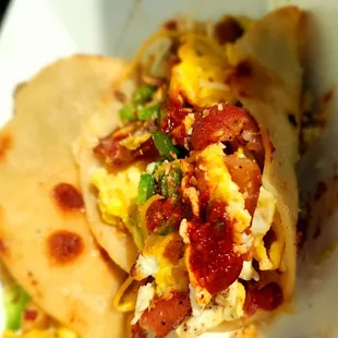 a close up of a breakfast burrito