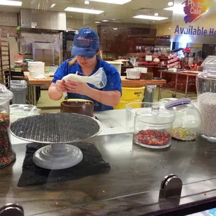 Prepping a Half Chocolate Half Lemon Doberge Cake for delivery  :)