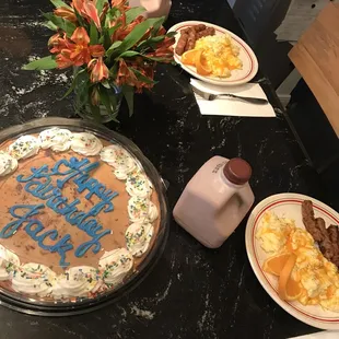 Bought cookie cake, man-boy sized chocolate milk, eggs, cheese, sausages and flowers to celebrate!