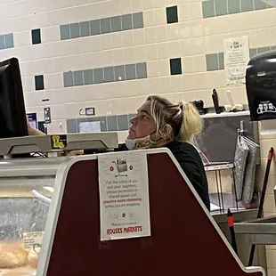 a woman sitting at a counter