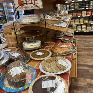 Different types of pies, cakes, and cookies for sale .