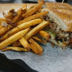 Delicious steak and cheese with house cut fries