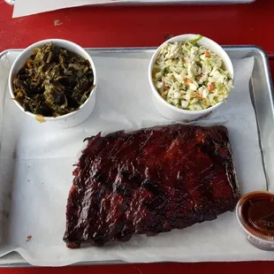 Half rack of ribs with cole slaw, collard greens, and husband took my garlic Texas toast.