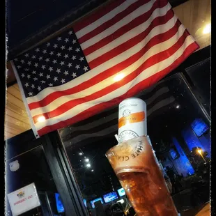 an american flag and a cold beverage