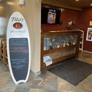 a surfboard in the lobby of a restaurant