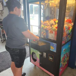 Trying his luck on the vending machine