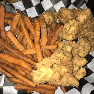 Hand-breaded chicken tenders with sweet potatoe fries. The fries had cinnamon sprinkled on them, again it was okay, but not expected