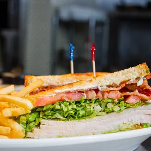 a club sandwich and french fries