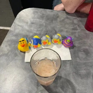 a glass of beer and rubber ducks
