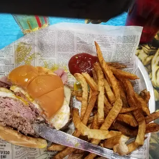 Fried egg burger with swiss and ham, 1/2 lb.