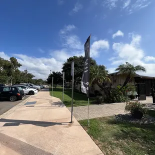 a street with cars parked on the side of the road