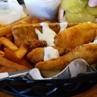 How her's looked after she added the tartar sauce. The top of the sandwich was buried under the fries.