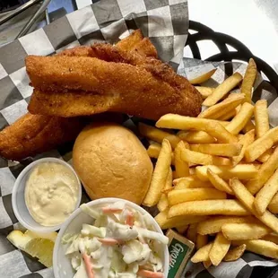a basket of fish and fries and coleslaw