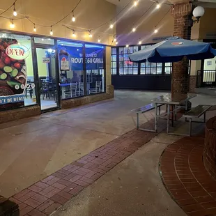 Covered outdoor seating just steps from the AMC ticket booth