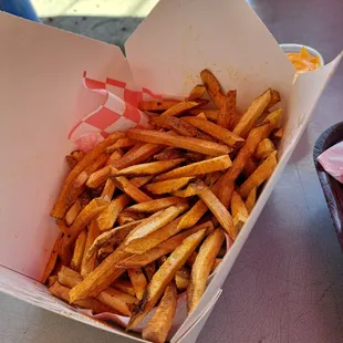 Fries with a side of cheese, pulled pork sandwich (cut in 1/2.) Plenty of food for 2 people