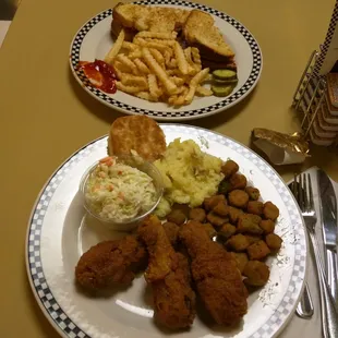 Chicken special on bottom ham sandwich plate top. They forgot the fruit salad.