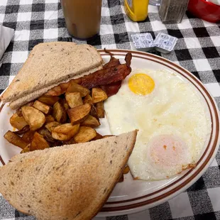 Two eggs, potato's, bacon and rye toast...mmmmm