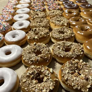 Maple Pecan Donuts Maple Frosted Donuts  Vanilla Frosted Donuts  Strawberry Frosted Sprinkle Donuts Chocolate Frosted Donuts