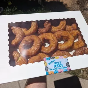 A whole dozen hand piped crullers,