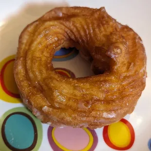 One cruller,  nice soft light glaze,