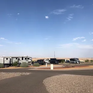 View of sites. No trees but that is to be expected. :) Nice rock landscaping and paved paths and sites.