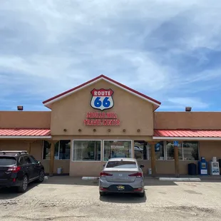 two cars parked in front of the building