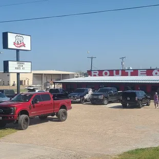 cars parked in front of the restaurant