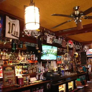 a bar with a ceiling fan