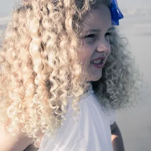 A girl looking at her parents during a photo session.