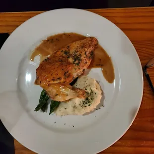 a plate of food on a wooden table