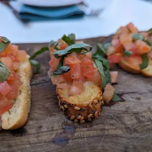 a close up of crosti on a cutting board