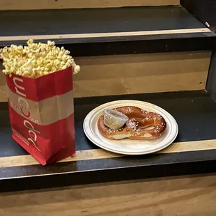 Popcorn and a pretzel with spicy mustard dip